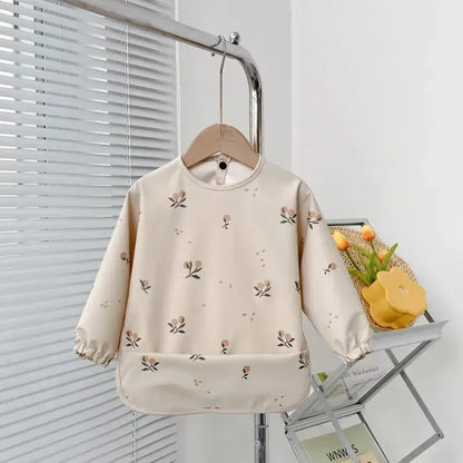 Pure Joy Messy Moments™ – Waterproof Baby Bib with Sleeves